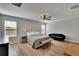 Main bedroom with hardwood floors and sitting area at 12783 Maple Bonsai Dr, Riverview, FL 33579