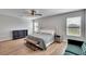 Main bedroom with hardwood floors and ensuite bathroom at 12783 Maple Bonsai Dr, Riverview, FL 33579