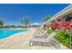 Modern lounge chairs situated by the refreshing community pool at 12783 Maple Bonsai Dr, Riverview, FL 33579