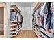 Spacious walk-in closet with custom shelving and ample storage at 12783 Maple Bonsai Dr, Riverview, FL 33579