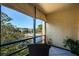 Relaxing balcony view with view of pool, lake, and lush tropical landscaping at 14130 Rosemary Ln # 4311, Largo, FL 33774