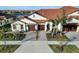 House with two-car garage and landscaping at 17523 Holly Well Ave, Wimauma, FL 33598