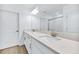 Modern bathroom with double vanity and quartz countertop at 17523 Holly Well Ave, Wimauma, FL 33598