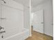 Clean bathroom, white subway tile shower, and bathtub at 17523 Holly Well Ave, Wimauma, FL 33598