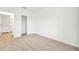 Bright bedroom with carpeted floor and spacious closet at 17523 Holly Well Ave, Wimauma, FL 33598