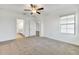 Spacious bedroom with carpet and access to bathroom at 17523 Holly Well Ave, Wimauma, FL 33598
