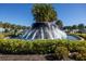 Community entrance with large fountain at 17523 Holly Well Ave, Wimauma, FL 33598