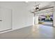 Spacious garage with open door and view of neighborhood at 17523 Holly Well Ave, Wimauma, FL 33598
