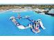 Aerial view of inflatable water park at 17523 Holly Well Ave, Wimauma, FL 33598