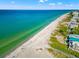 Aerial view of pristine beach and oceanfront homes at 19915 Gulf Blvd # 805, Indian Shores, FL 33785