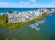 Aerial view of waterfront community with boat slips and ocean access at 19915 Gulf Blvd # 805, Indian Shores, FL 33785