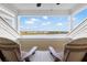 Balcony with water view and seating for two at 19915 Gulf Blvd # 805, Indian Shores, FL 33785