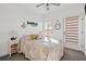 Bright bedroom with a queen bed and nautical-themed decor at 19915 Gulf Blvd # 805, Indian Shores, FL 33785