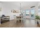 Bright dining room with water views and wooden table at 19915 Gulf Blvd # 805, Indian Shores, FL 33785