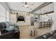 Open living space with kitchen and leather couches at 19915 Gulf Blvd # 805, Indian Shores, FL 33785