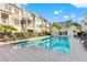 Community pool with plenty of lounge chairs at 19915 Gulf Blvd # 805, Indian Shores, FL 33785