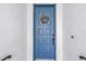 Blue front door accented with a stylish gold wreath at 2204 W Horatio St, Tampa, FL 33606