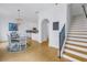 View of stairs and dining area with hardwood floors and chandelier at 2204 W Horatio St, Tampa, FL 33606