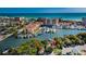 Aerial view of waterfront property, showing a house and marina at 249 Boca Ciega Dr, Madeira Beach, FL 33708