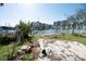 Backyard patio with canal views, showing damage at 249 Boca Ciega Dr, Madeira Beach, FL 33708