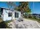 Small patio area adjacent to the house at 249 Boca Ciega Dr, Madeira Beach, FL 33708