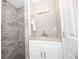 Bathroom features a single vanity and walk-in shower at 249 Boca Ciega Dr, Madeira Beach, FL 33708