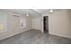 Spacious bedroom with wood-look floors and ceiling fan at 249 Boca Ciega Dr, Madeira Beach, FL 33708