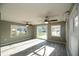 Spacious Florida room with water views and tile flooring at 249 Boca Ciega Dr, Madeira Beach, FL 33708
