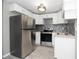Modern kitchen with stainless steel appliances and white cabinets at 249 Boca Ciega Dr, Madeira Beach, FL 33708