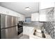 Updated kitchen with stainless steel appliances at 249 Boca Ciega Dr, Madeira Beach, FL 33708