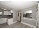 Modern white kitchen with granite countertops at 249 Boca Ciega Dr, Madeira Beach, FL 33708