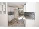 Efficient kitchen with white cabinets and granite countertops at 249 Boca Ciega Dr, Madeira Beach, FL 33708