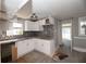 Modern kitchen with white cabinets and granite countertops at 249 Boca Ciega Dr, Madeira Beach, FL 33708