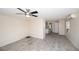 Spacious living room featuring tile floors and a ceiling fan at 249 Boca Ciega Dr, Madeira Beach, FL 33708