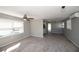 Bright living room with hardwood floors and ceiling fan at 249 Boca Ciega Dr, Madeira Beach, FL 33708