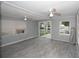 Bright living room with tile floors and sliding glass doors at 249 Boca Ciega Dr, Madeira Beach, FL 33708