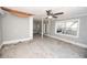 Spacious living room with hardwood floors and ceiling fan at 249 Boca Ciega Dr, Madeira Beach, FL 33708