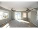 Living room with water view and sliding glass doors at 249 Boca Ciega Dr, Madeira Beach, FL 33708