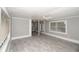 Spacious living room with tile floors and built-in shelves at 249 Boca Ciega Dr, Madeira Beach, FL 33708