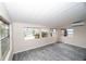 Sunroom with walls of windows offering water views at 249 Boca Ciega Dr, Madeira Beach, FL 33708