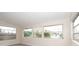 Bright sunroom featuring multiple windows and water views at 249 Boca Ciega Dr, Madeira Beach, FL 33708