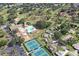 Elevated perspective of a community featuring tennis courts, a pool, and a golf course at 2740 Highlands Blvd # D, Palm Harbor, FL 34684