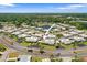 High-angle view of a residential community with numerous houses and lush greenery at 2740 Highlands Blvd # D, Palm Harbor, FL 34684