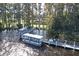 Aerial view of a pontoon boat approaching a dock on the lake at 2740 Highlands Blvd # D, Palm Harbor, FL 34684