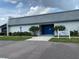 Andover Village clubhouse exterior with blue entry door at 2740 Highlands Blvd # D, Palm Harbor, FL 34684