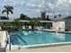 Inviting community pool with clear blue water and ample seating at 2740 Highlands Blvd # D, Palm Harbor, FL 34684