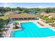 Large community pool with covered seating area at 2740 Highlands Blvd # D, Palm Harbor, FL 34684