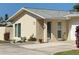 One-story home with attached garage and landscaped front yard at 2740 Highlands Blvd # D, Palm Harbor, FL 34684