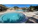 Community hot tub and pool on a sunny day at 2740 Highlands Blvd # D, Palm Harbor, FL 34684
