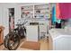 Laundry room with washer, dryer, utility sink, and storage at 2740 Highlands Blvd # D, Palm Harbor, FL 34684